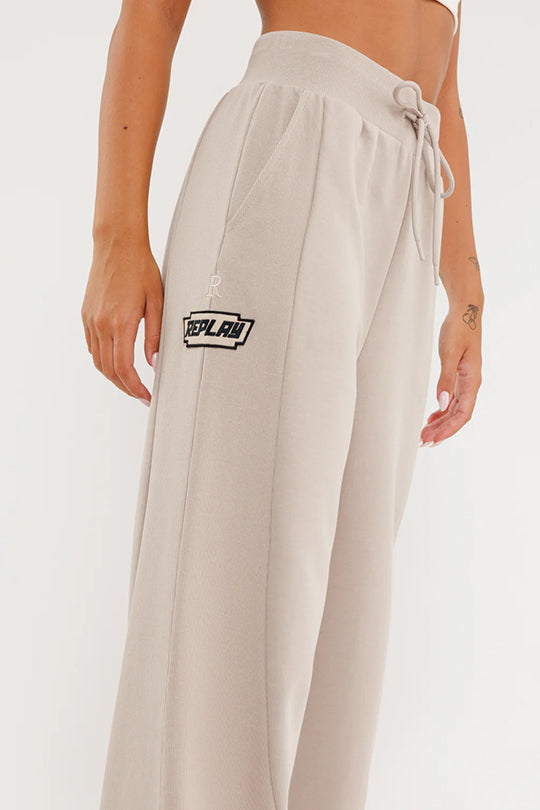 מכנסיים ארוכים לנשים בצבע בז' עם לוגו
